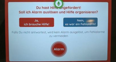 Das System fragt schriftlich: Du hast Hilfe angefordert. Soll ich Alarm auslösen und Hilfe organisieren? Zur Antwort stehen ein roter Button für Ja und ein blauer Button für Nein.